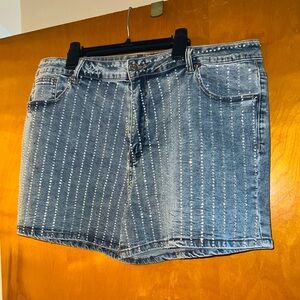 Studded denim shorts.